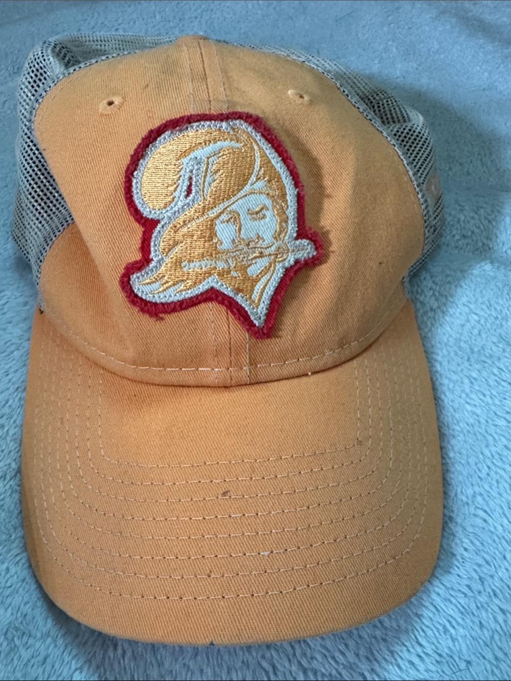 Orange Trucker Hat with Embroidered Pirate Crest Buccaneers creamsicle